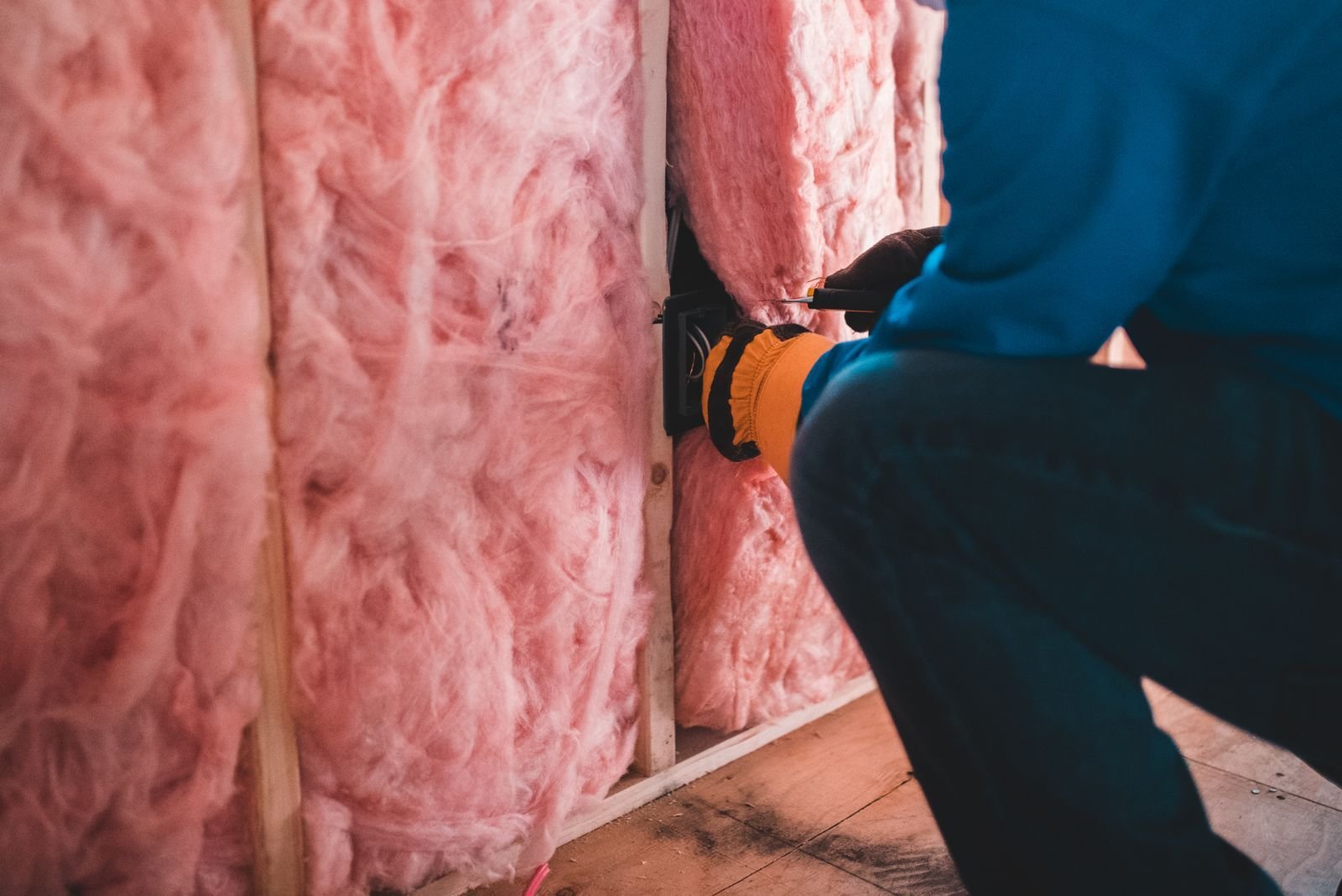 Attic space with insulation where water heaters and AC units often sit in newer homes