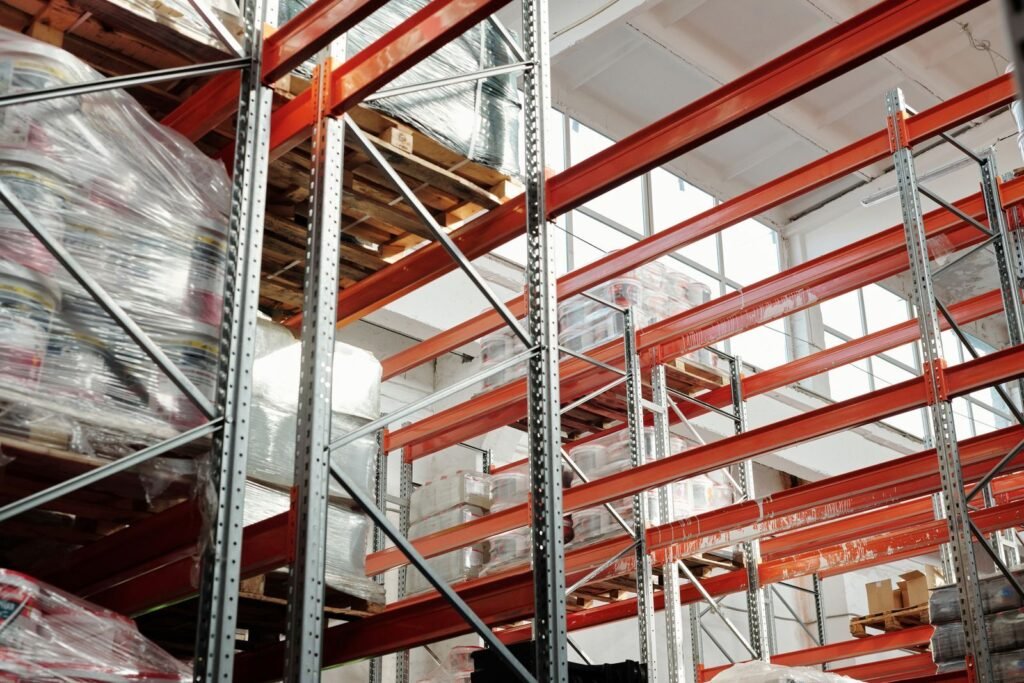 Warehouse interior with water pooled across the concrete floor