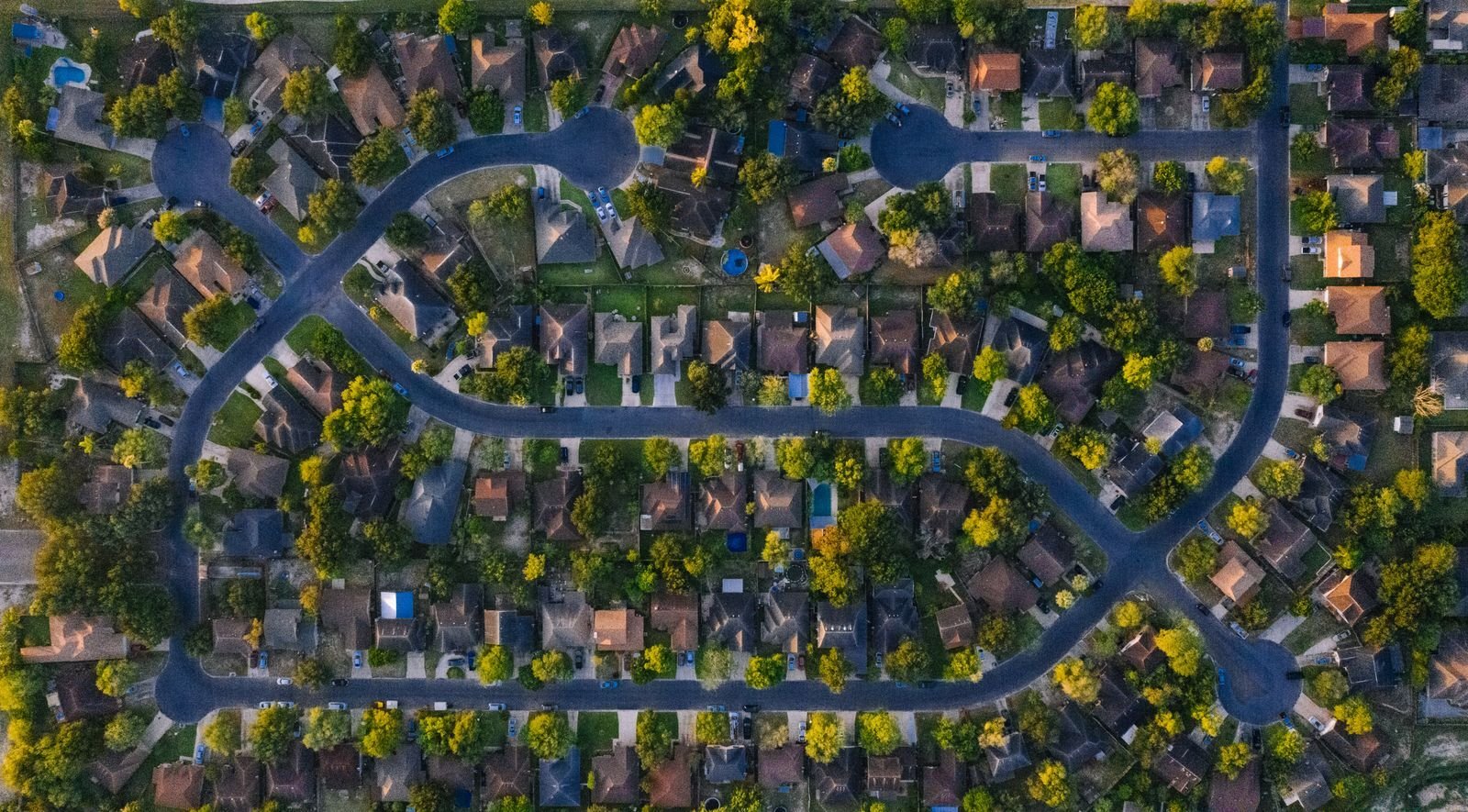 Aerial view of North Texas homes on large lots with open land around them
